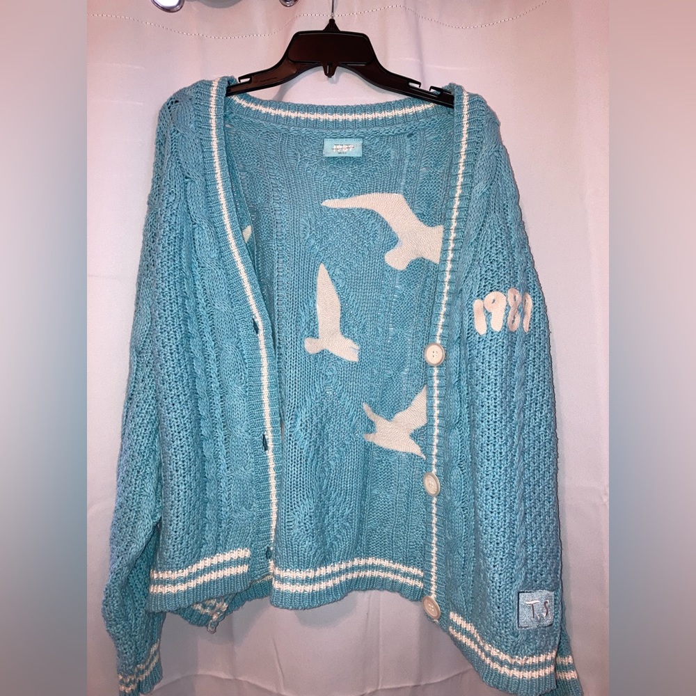 Brand new, never worn, Taylor Swift 1989 cardigan. Size is M/L.